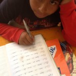 Boy studying in Peru